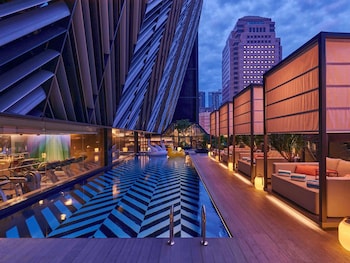Outdoor pool, open 6:00 AM to 10:00 PM, free pool cabanas