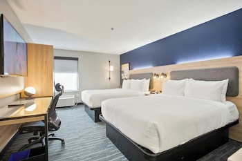 Premium bedding, desk, laptop workspace, iron/ironing board