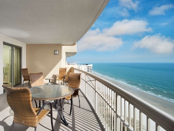 Suite, 4 Bedrooms, Oceanfront (Margate) | Living area | 50-inch flat-screen TV with cable channels, TV