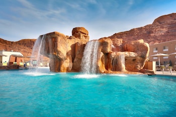 Seasonal outdoor pool, open 8:00 AM to 10:00 PM, pool umbrellas