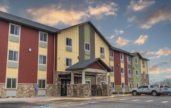 Premium bedding, pillow-top beds, desk, laptop workspace