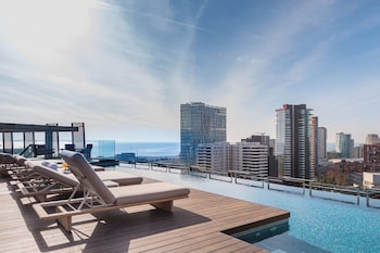 Outdoor pool, open 9:00 AM to 9:00 PM, pool umbrellas, sun loungers