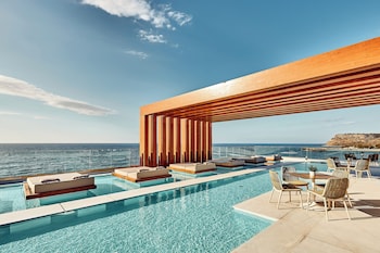 Seasonal outdoor pool, open 8:30 AM to 8:00 PM, pool umbrellas