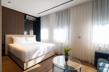 Appartement Deluxe | Coin séjour | TV connectée de 50 pouces avec chaînes par câble