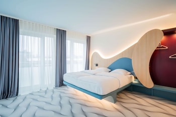Premium bedding, desk, laptop workspace, iron/ironing board