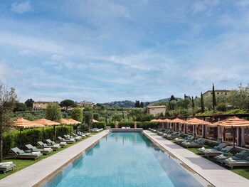 Seasonal outdoor pool, open 10:00 AM to 8:00 PM, pool umbrellas