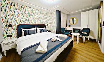 Premium bedding, memory-foam beds, free minibar, desk