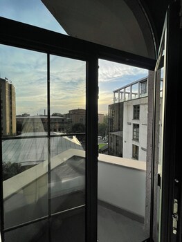 Panoramic views of the urban landscape unfold from large windows in this modern space.