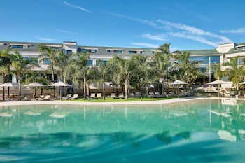Seasonal outdoor pool, open 10:00 AM to 8:30 PM, pool umbrellas
