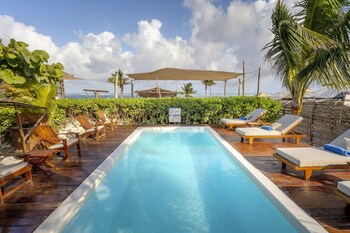 On the beach, white sand, sun loungers, beach umbrellas