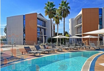 Seasonal outdoor pool, open 10:00 AM to 6:00 PM, sun loungers