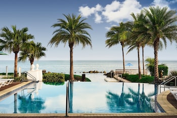 On the beach, beach cabanas, sun loungers