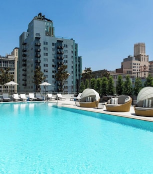 Outdoor pool, open 7 AM to 10 PM, free pool cabanas, pool loungers