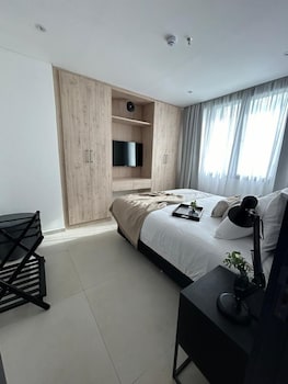 Family Suite | Living area | 30-inch Smart TV with digital channels