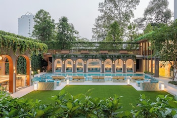 Outdoor pool, open 7:00 AM to 7:00 PM, pool umbrellas, sun loungers