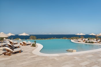 Indoor pool, seasonal outdoor pool, pool umbrellas, pool loungers