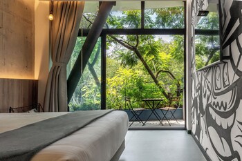 Deluxe Room, 1 King Bed, Balcony, City View | Premium bedding, minibar, in-room safe, blackout drapes