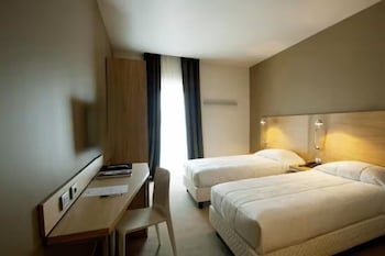 Down comforters, memory foam beds, in-room safe, desk