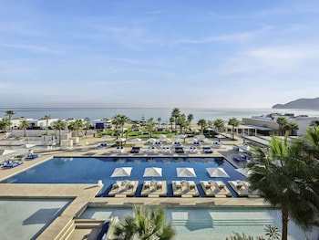 Indoor pool, outdoor pool, pool umbrellas, sun loungers