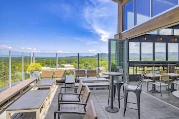 Enjoy a sophisticated dining experience with a view of the surrounding landscape from our elegant dining area.