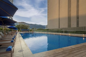 Outdoor pool, open 9:00 AM to 9:00 PM, sun loungers