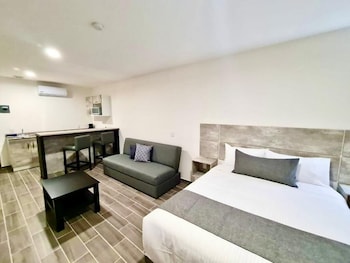 Suite Deluxe | Bureau, accès au Wi-Fi (inclus), literie fournie