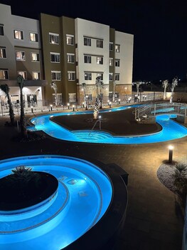 Outdoor pool, open 6:00 AM to 11:00 PM, free cabanas, pool umbrellas