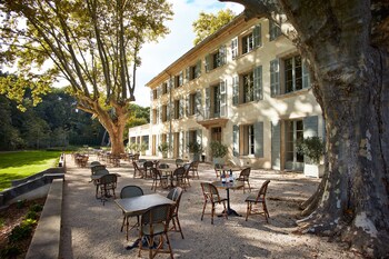 Enjoy al fresco dining on the hotel's charming garden-terrace, surrounded by lush greenery and shaded seating areas.