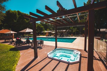 Indoor pool, outdoor pool, open 10:00 AM to 10:00 PM, pool umbrellas