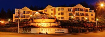 A multi-story hotel with a prominent entrance sign.