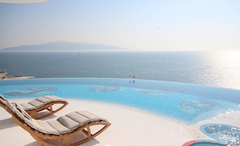 Indoor pool, seasonal outdoor pool, pool umbrellas, sun loungers