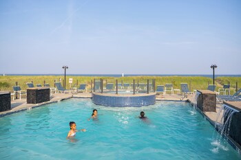 Outdoor pool, open 9 AM to 10 PM, sun loungers