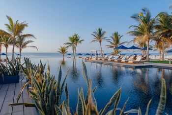 Outdoor pool, open 7:00 AM to 7:00 PM, free cabanas, pool umbrellas