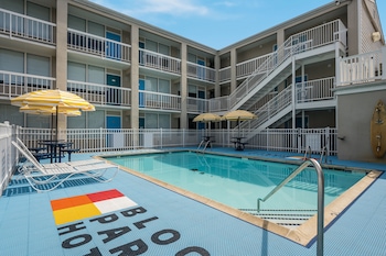 Seasonal outdoor pool, open 9:00 AM to 9:00 PM, pool umbrellas