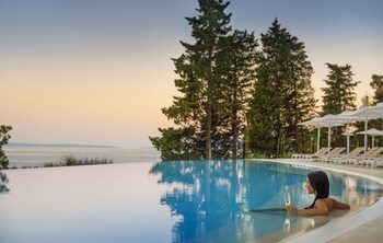 Seasonal outdoor pool, open 8:00 AM to 8:00 PM, pool umbrellas