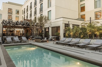 Outdoor pool, pool umbrellas, sun loungers