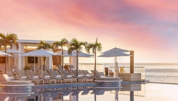 4 outdoor pools, cabanas (surcharge), pool umbrellas