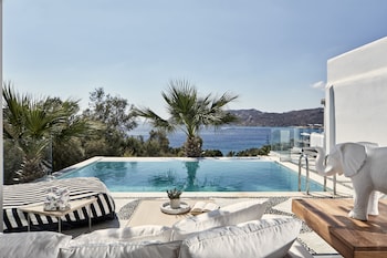 Seasonal outdoor pool, open 11:00 AM to 7:00 PM, pool umbrellas