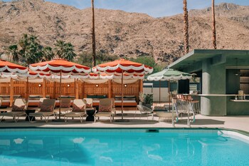 Outdoor pool, open 8:00 AM to 10:00 PM, cabanas (surcharge)