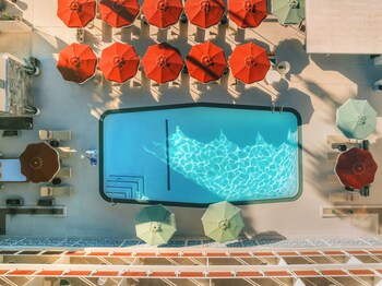 Outdoor pool, open 8:00 AM to 10:00 PM, cabanas (surcharge)