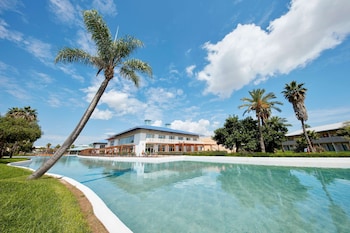 Indoor pool, seasonal outdoor pool, pool umbrellas, pool loungers