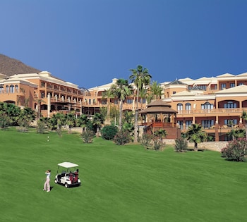 Indoor pool, outdoor pool, pool umbrellas, pool loungers