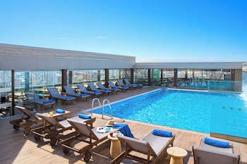 Seasonal outdoor pool, pool umbrellas, sun loungers