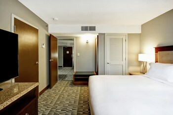 A spacious indoor area with a pool, seating, and a reception desk.
