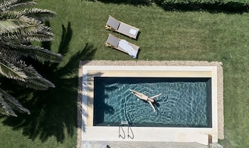 Outdoor pool, open 8:00 AM to 8:00 PM, pool umbrellas, sun loungers