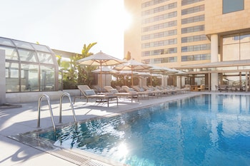 Seasonal outdoor pool, pool umbrellas, pool loungers