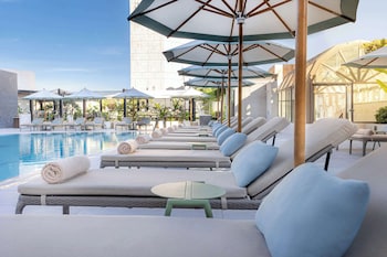Seasonal outdoor pool, pool umbrellas, pool loungers