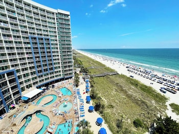 Indoor pool, 2 outdoor pools, open 8 AM to 10 PM, pool umbrellas