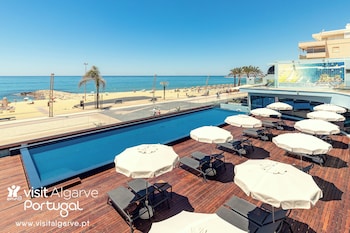 Outdoor pool, open 9:00 AM to 8:00 PM, pool umbrellas, sun loungers