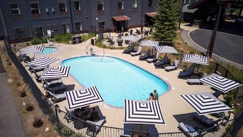 Seasonal outdoor pool, open 8:00 AM to 10:00 PM, pool umbrellas